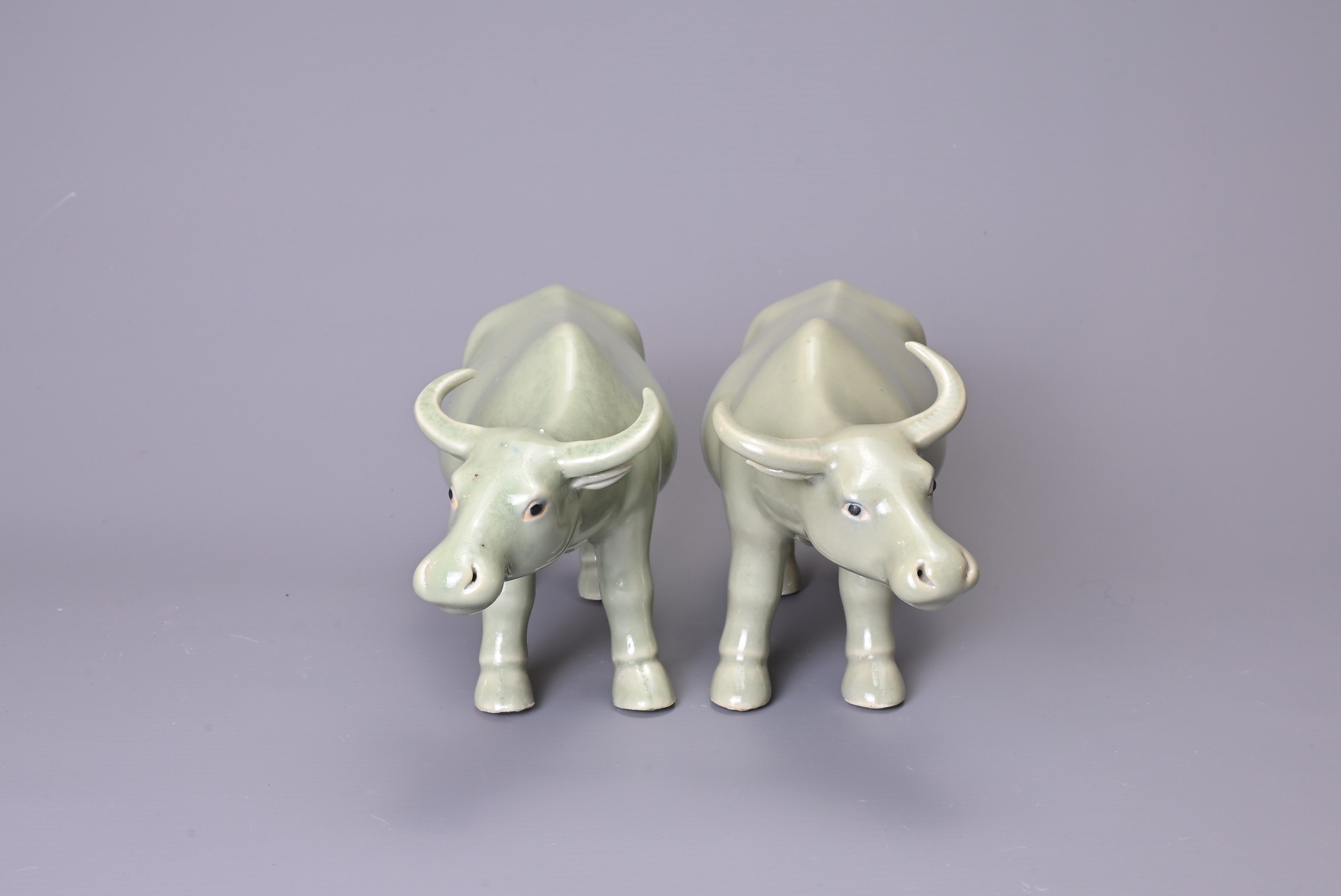 A PAIR OF CHINESE CELADON GLAZED PORCELAIN MODELS OF OX, 20th Century, approx. 21 cm long (2) - Image 2 of 5