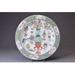 A LARGE CHINESE FAMILLE VERTE PORCELAIN DISH, 18TH CENTURY. Decorated with various treasured objects