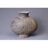 A CHINESE BURNISHED AND INCISED POTTERY COCOON JAR, HAN DYNASTY. Often referred to as a 'cocoon jar'