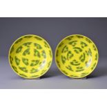 A PAIR OF CHINESE YELLOW GROUND PORCELAIN SAUCERS, TONGZHI MARKS. Each bright yellow ground with