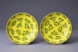 A PAIR OF CHINESE YELLOW GROUND PORCELAIN SAUCERS, TONGZHI MARKS. Each bright yellow ground with