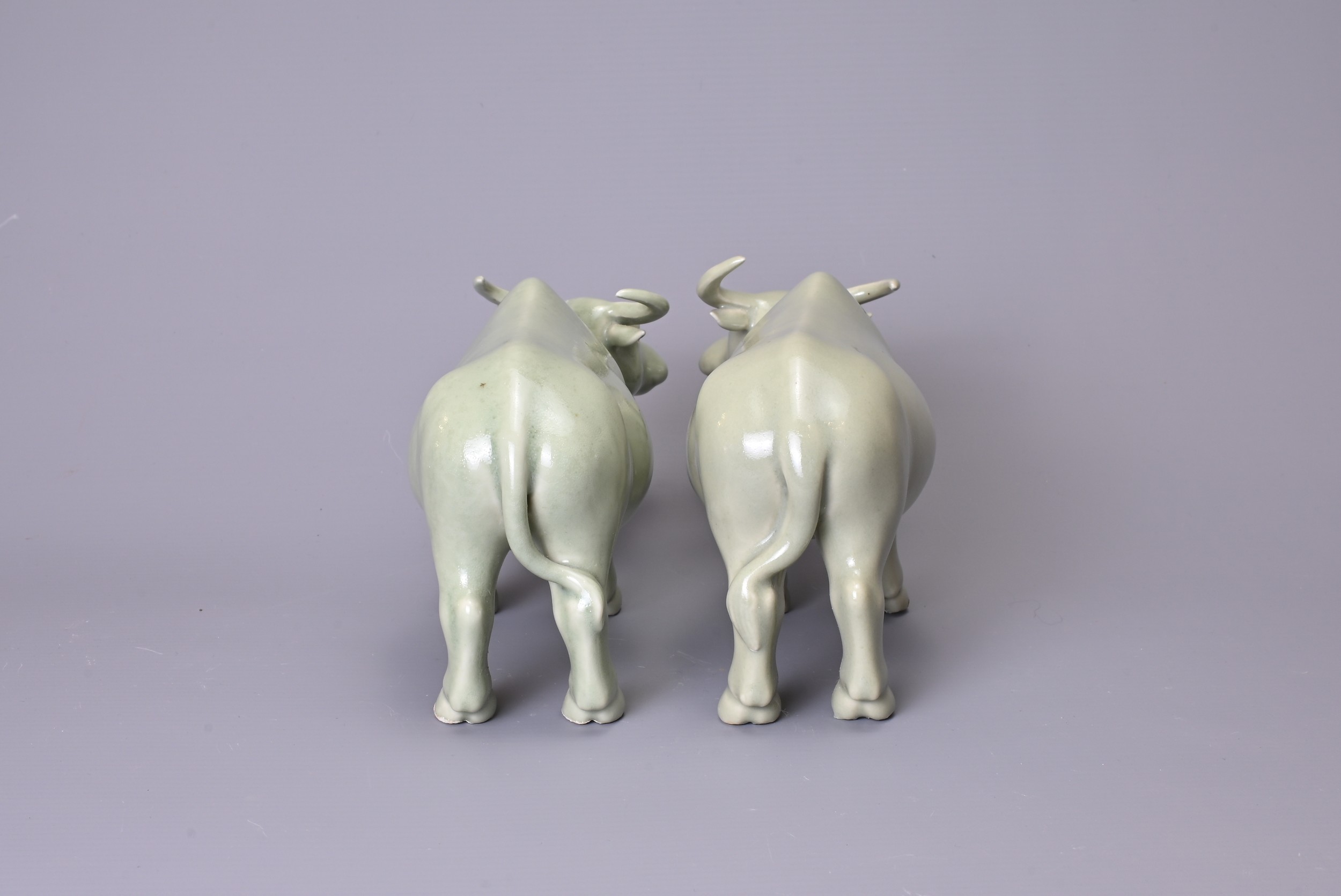 A PAIR OF CHINESE CELADON GLAZED PORCELAIN MODELS OF OX, 20th Century, approx. 21 cm long (2) - Image 4 of 5