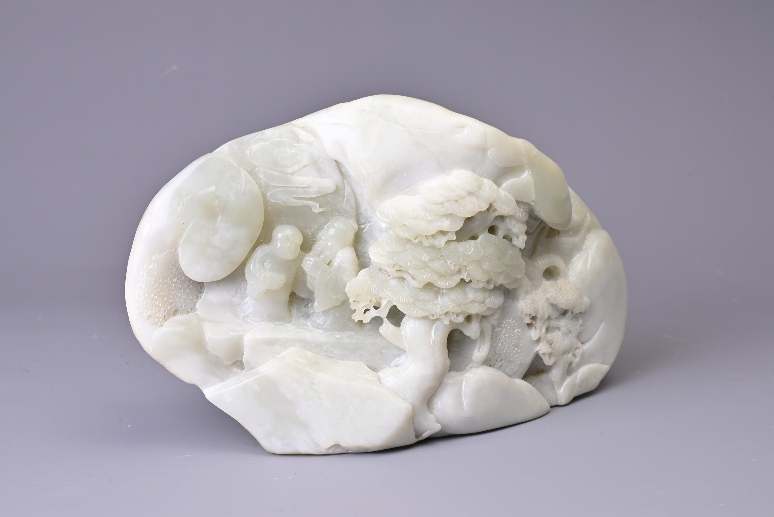 A CARVED PALE JADE BOULDER. Carved with two figures standing on pierced rockwork and trees, with - Image 6 of 8