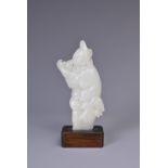 A CHINESE WHITE JADE PENDANT CARVING OF A MAN, QING DYNASTY. Well carved figure of a man stood