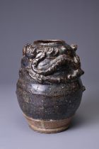 A CHINESE STONEWARE DRAGON JAR, SONG DYNASTY (AD 960 - 1279). Heavily potted with applied decoration