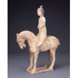 A CHINESE PAINTED POTTERY HORSE AND FEMALE RIDER, TANG DYNASTY (AD 618- 907). The horse standing