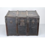 A LARGE WOODEN BOUND TRAVELLER'S TRUNK, early 20th century, with metal fittings, canvas covered
