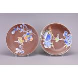 A PAIR OF JAPANESE BROWN-GROUND CIRCULAR DISHES. Each signed in blue to reverse, decorated in