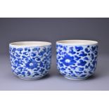 TWO CHINESE BLUE AND WHITE PORCELAIN JARS, 18TH CENTURY. Each with continuous floral scroll
