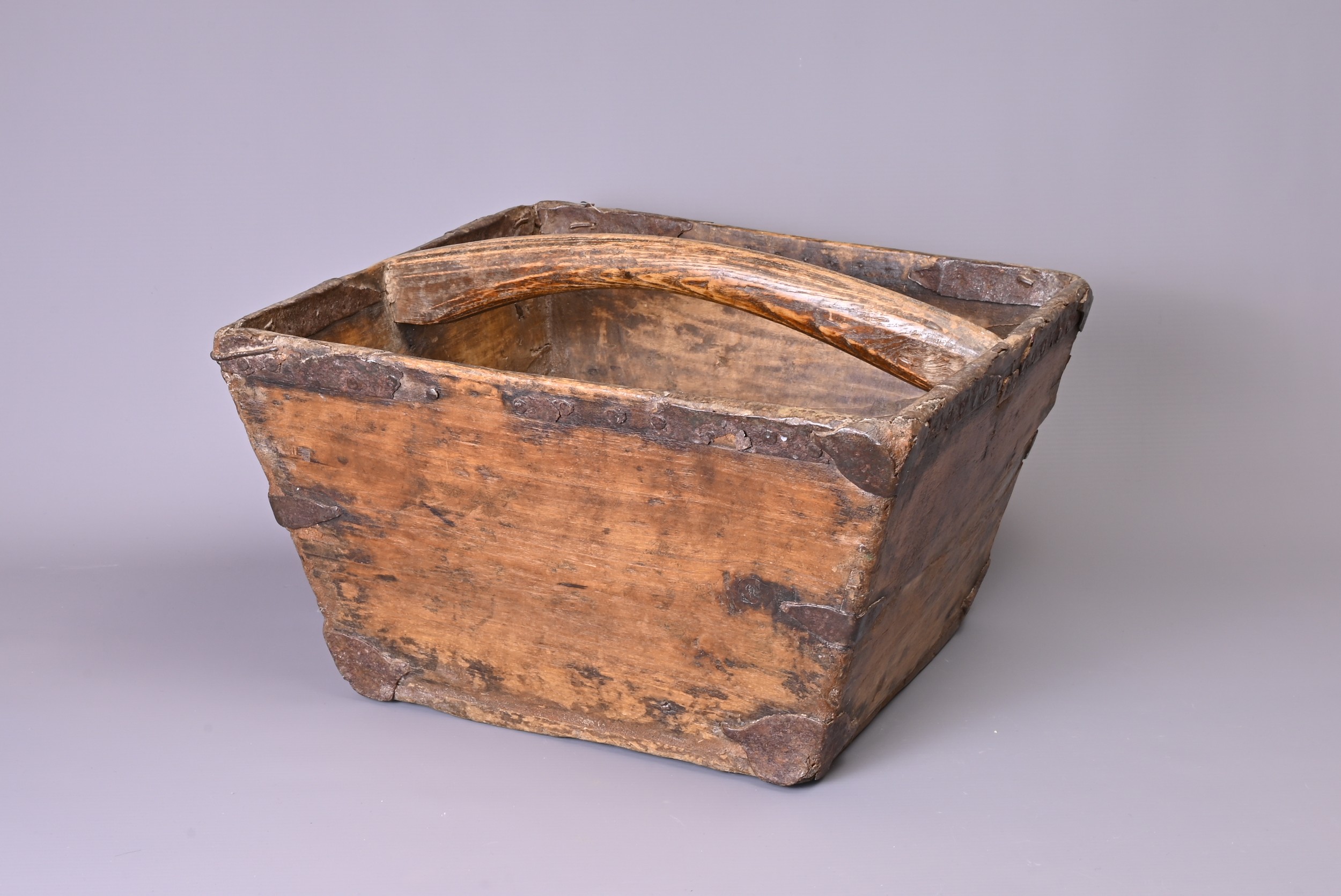 CHINESE 19TH/20TH CENTURY SQUARE-FORM RICE GRAIN BUCKET, with central handle and metal fittings.