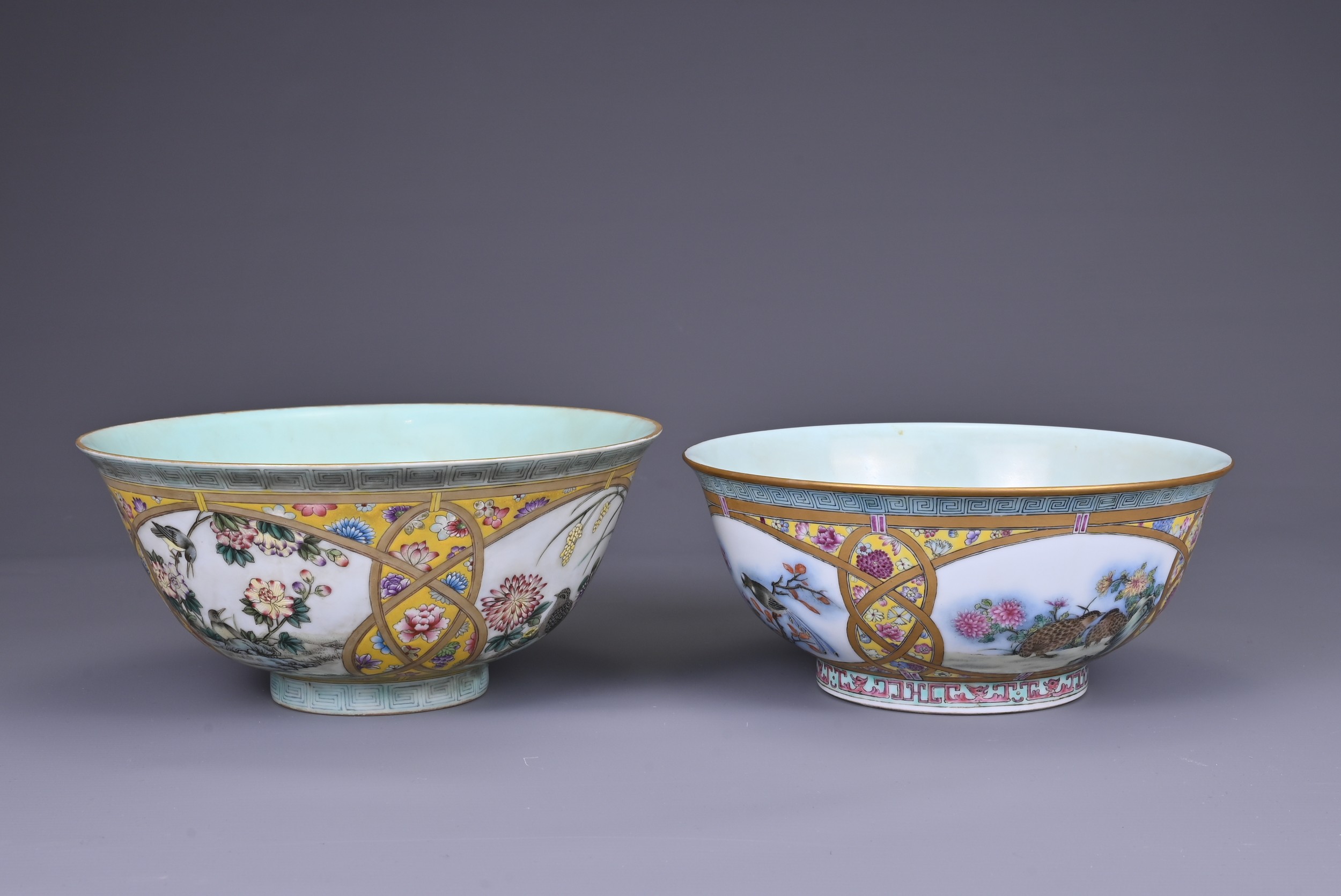 TWO CHINESE FAMILLE ROSE ENAMELLED YELLOW GROUND BOWLS, 20TH CENTURY. One with enamelled four