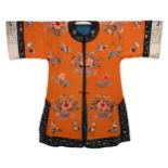 A CHINESE EMBROIDERED SILK ORANGE-GROUND ROBE, CIRCA 1920. Finely embroidered with jardinieres of