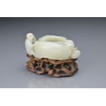 A CHINESE WHITE JADE BRUSH WASHER / WATER POT, QING DYNASTY. In the form of a hollowed peach on a