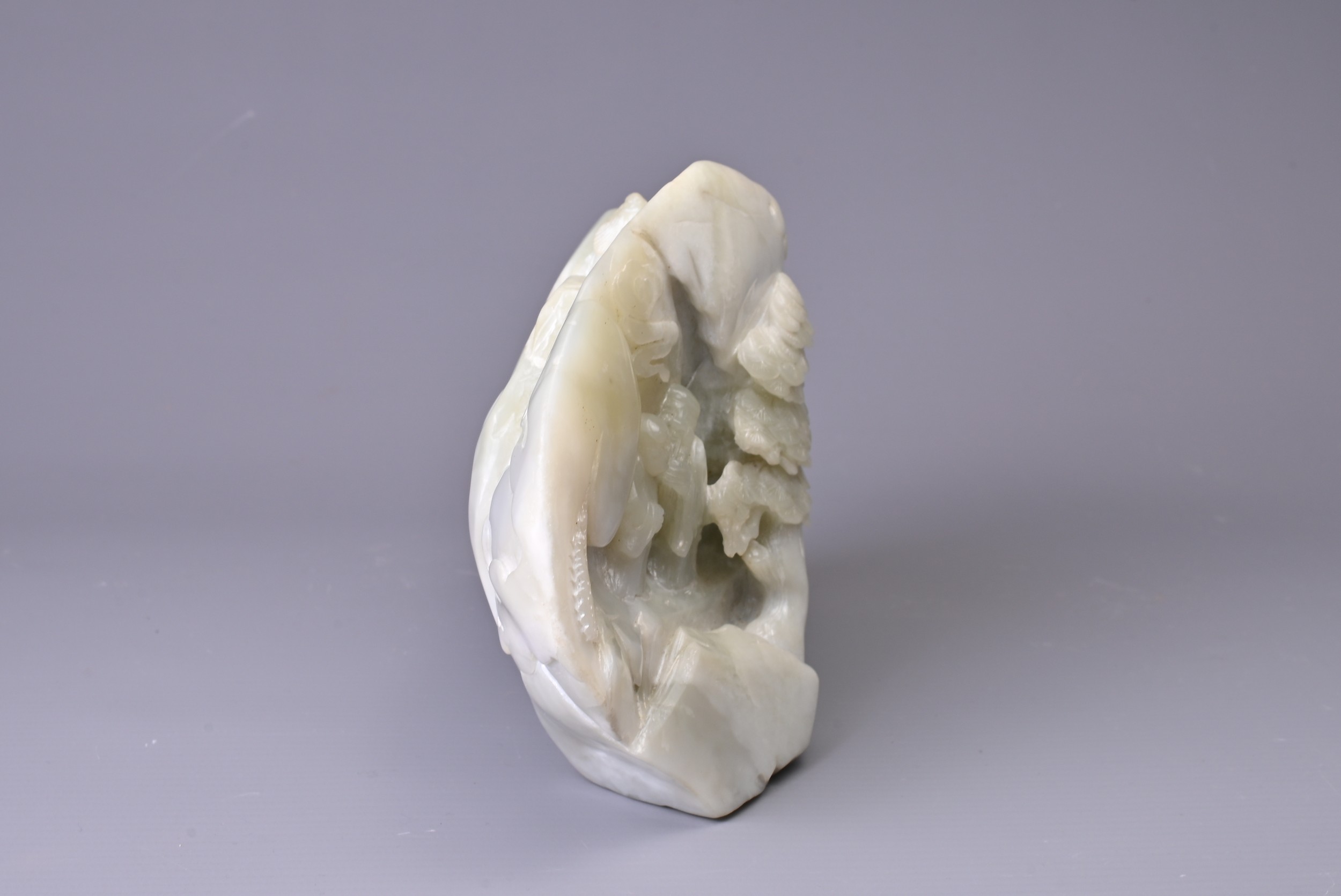 A CARVED PALE JADE BOULDER. Carved with two figures standing on pierced rockwork and trees, with - Image 5 of 8