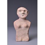 AN UNUSUAL POTTERY HUMAN FEMALE FIGURE, NEOLITHIC OR LATER. A pottery figure of a female with good
