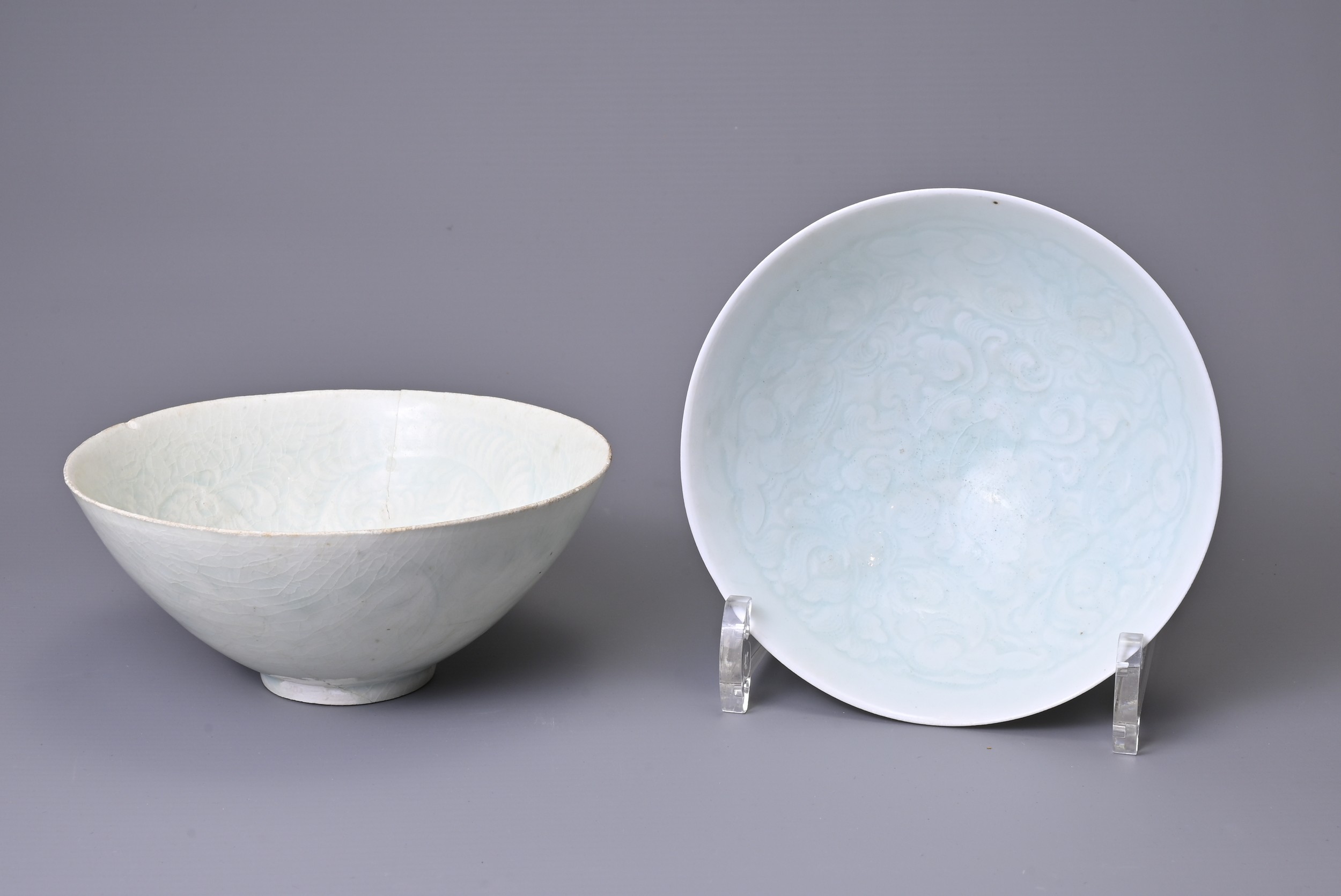 TWO CHINESE QINGBAI PORCELAIN BOWLS, SONG DYNASTY (960-1279). One with central chrysanthemum