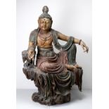 A VERY LARGE POLYCHROME PAINTED WOOD FIGURE OF WATER MOON GUANYIN, QING DYNASTY. The Bodhisattva