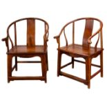 A PAIR OF CHINESE HUANGHUALI HORSESHOE BACK ARMCHAIRS, QUANYI, 20TH CENTURY. A curved top rail of