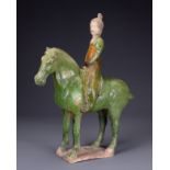 A CHINESE SANCAI GLAZED POTTERY MODEL OF A HORSE AND FEMALE RIDER, TL TESTED, TANG DYNASTY (AD 618-