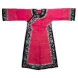 A CHINESE EMBROIDERED PINK-GROUND SILK GAUZE LADY'S ROBE, EARLY 20TH CENTURY. The pink ground with