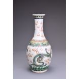 A CHINESE FAMILLE VERTE PORCELAIN VASE, 19TH CENTURY. Of bottle form decorated with two dragons