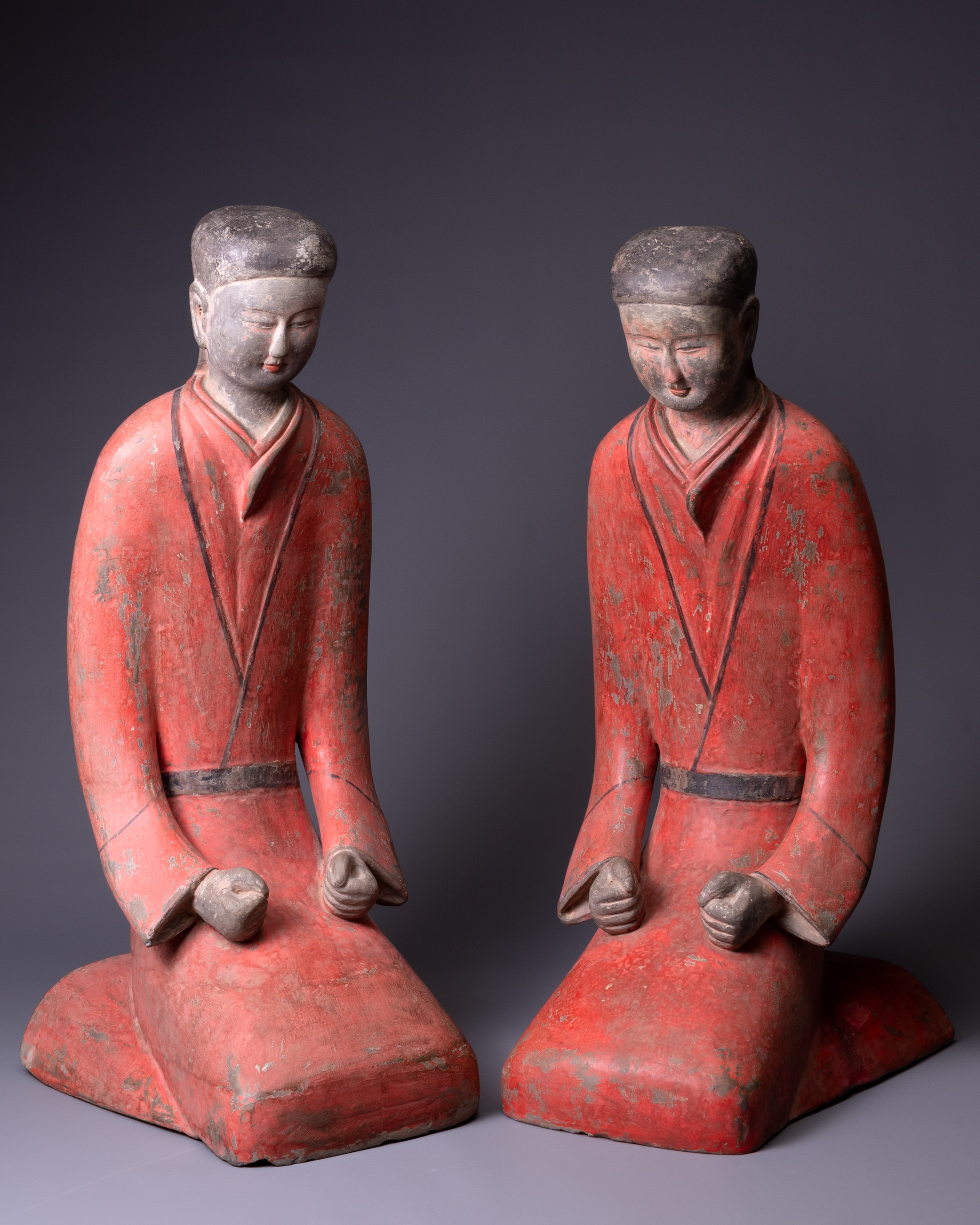 A PAIR OF LARGE CHINESE PAINTED POTTERY FIGURES OF KNEELING WOMEN, TL TESTED OF HAN DYNASTY. Each
