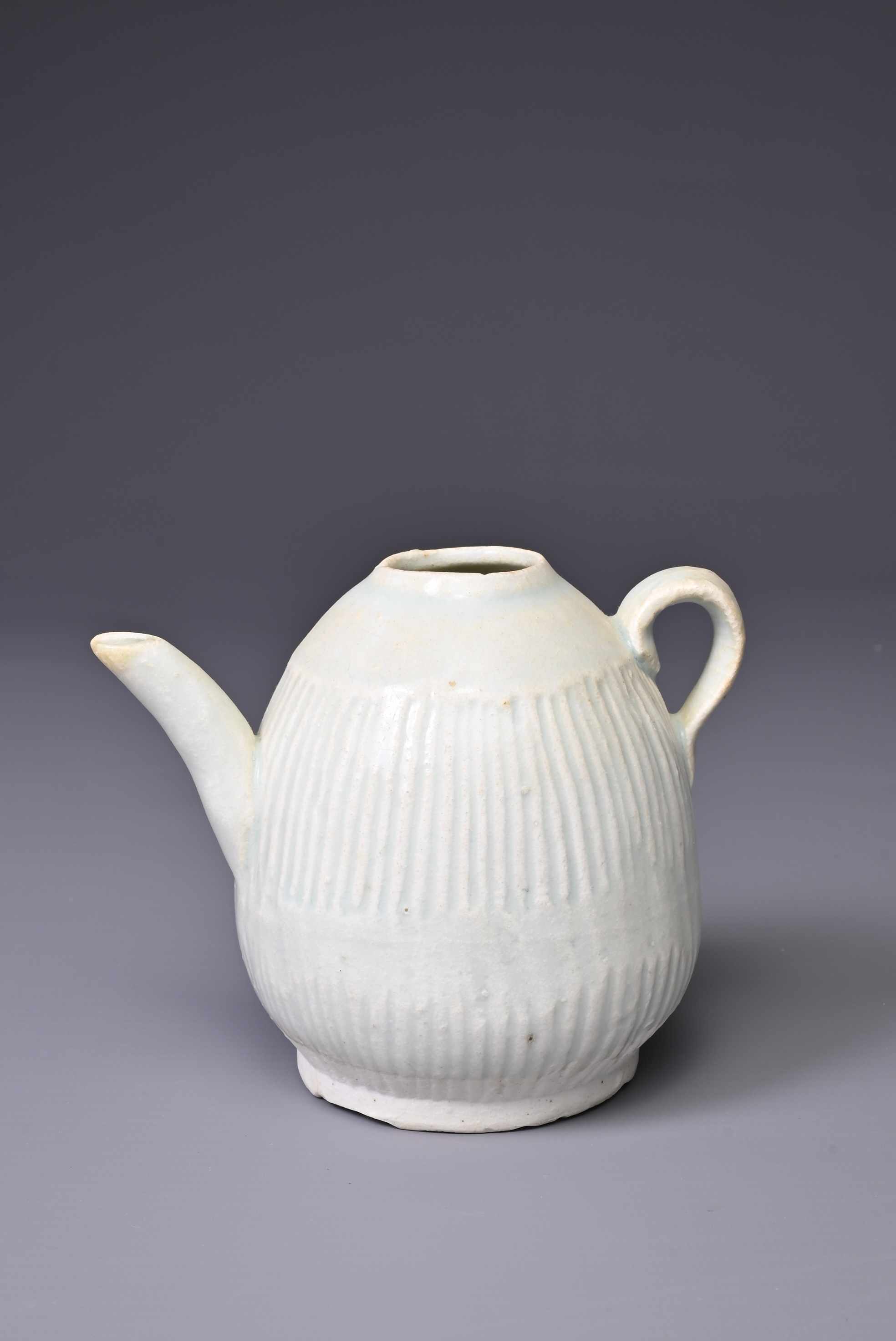 A CHINESE QINGBAI WARE EWER, SONG DYNASTY (960-1279). Finely potted ovoid body with continuous
