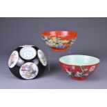 THREE CHINESE PORCELAIN COLOURED GROUND BOWLS, 20TH CENTURY. Comprising two coral red ground