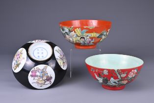 THREE CHINESE PORCELAIN COLOURED GROUND BOWLS, 20TH CENTURY. Comprising two coral red ground