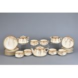 A JAPANESE TWENTY ONE PIECE SATSUMA WARE TEA SET, EARLY 20TH CENTURY. Set for six with cups,