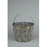 A SILVER REPOUSSE BUCKET, THAI MARKET, EARLY 20TH CENTURY.