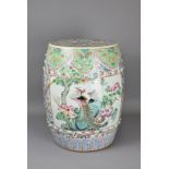 A LARGE CHINESE FAMILLE ROSE PORCELAIN DRUM STOOL, LATE QING DYNASTY. Studded body with panels of