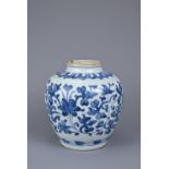 A CHINESE BLUE AND WHITE PORCELAIN JAR, LATE MING DYNASTY. Continuous floral scroll decoration below