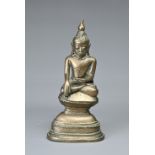 A SOUTH EAST ASIAN BRONZE FIGURE OF DEITY, 19/20TH CENTURY. Seated on pedestal base. 17.5cm tall