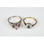 A 9CT WHITE GOLD DIAMOND AND RUBY MOUNTED RING AND A 9CT WHITE GOLD DIAMOND AND BLUE STONE MOUNTED