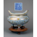 A CHINESE SKY BLUE GROUND AND GILT PORCELAIN TRIPOD CENSER, QIANLONG MARK, 18/19TH CENTURY.