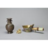 A GROUP OF VINTAGE CHINESE BRONZE / BRASS ITEMS. To include a silk iron decorated with Buddhist