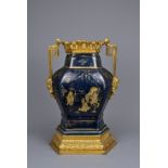 A CHINESE POWDER BLUE AND GILT DECORATED VASE WITH ORMOLU MOUNT, 18/19TH CENTURY. The hexagonal vase