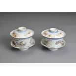 A PAIR OF CHINESE FAMILLE ROSE CUPS AND STANDS, EARLY 20TH CENTURY. Finley potted cups with enamel