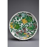 A CHINESE BISCUIT ENAMELLED SANCAI PORCELAIN DISH, KANGXI MARK. Creamy white glazed porcelain body