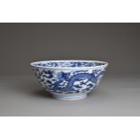 A CHINESE BLUE AND WHITE PORCELAIN BOWL, 19TH CENTURY. Decorated to the exterior with two dragons