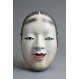 A JAPANESE PORCELAIN SIGNED OKAME NOH MASK. Signed in red overglaze enamel to reverse, with red lips