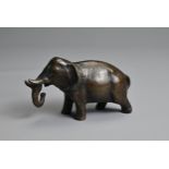 A JAPANESE MEIJI PERIOD (1868-1912) BRONZE WATER DROPPER MODELLED AS AN ELEPHANT. Naturalistically