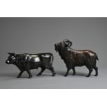 A 20TH CENTURY JAPANESE BRONZE MODEL OF A COW AND A MODEL OF A RAM. Each naturalistically cast