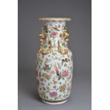 A CHINESE CANTON FAMILLE ROSE PORCELAIN VASE, 19TH CENTURY. Of baluster form decorated with birds,