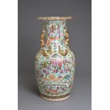 A CHINESE CANTON FAMILLE ROSE PORCELAIN VASE, 19TH CENTURY. Of baluster form decorated with
