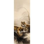A 20TH CENTURY JAPANESE SILK SCROLL PAINTING OF TIGERS. Depicting two tigers amongst foliage, in
