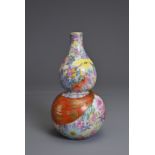 A CHINESE MILLEFLEURS DECORATED DOUBLE GOURD PORCELAIN VASE, QIANLONG MARK. Decorated with colourful