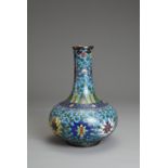 A CHINESE CLOISONNE ENAMEL BOTTLE VASE, EARLY 20TH CENTURY. Decorated with chrysanthemums with leafy