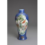 A CHINESE BLUE GROUND AND GILT FAMILLE VERTE PORCELAIN VASE, 19TH CENTURY. Decorated with various